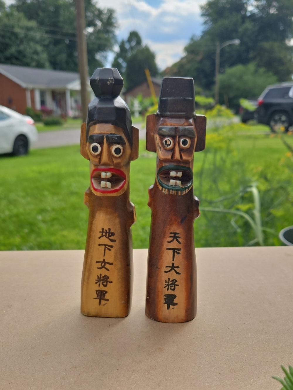 Hand Carved Wooden Asian Figurine Pair - Brown with Painted Accents